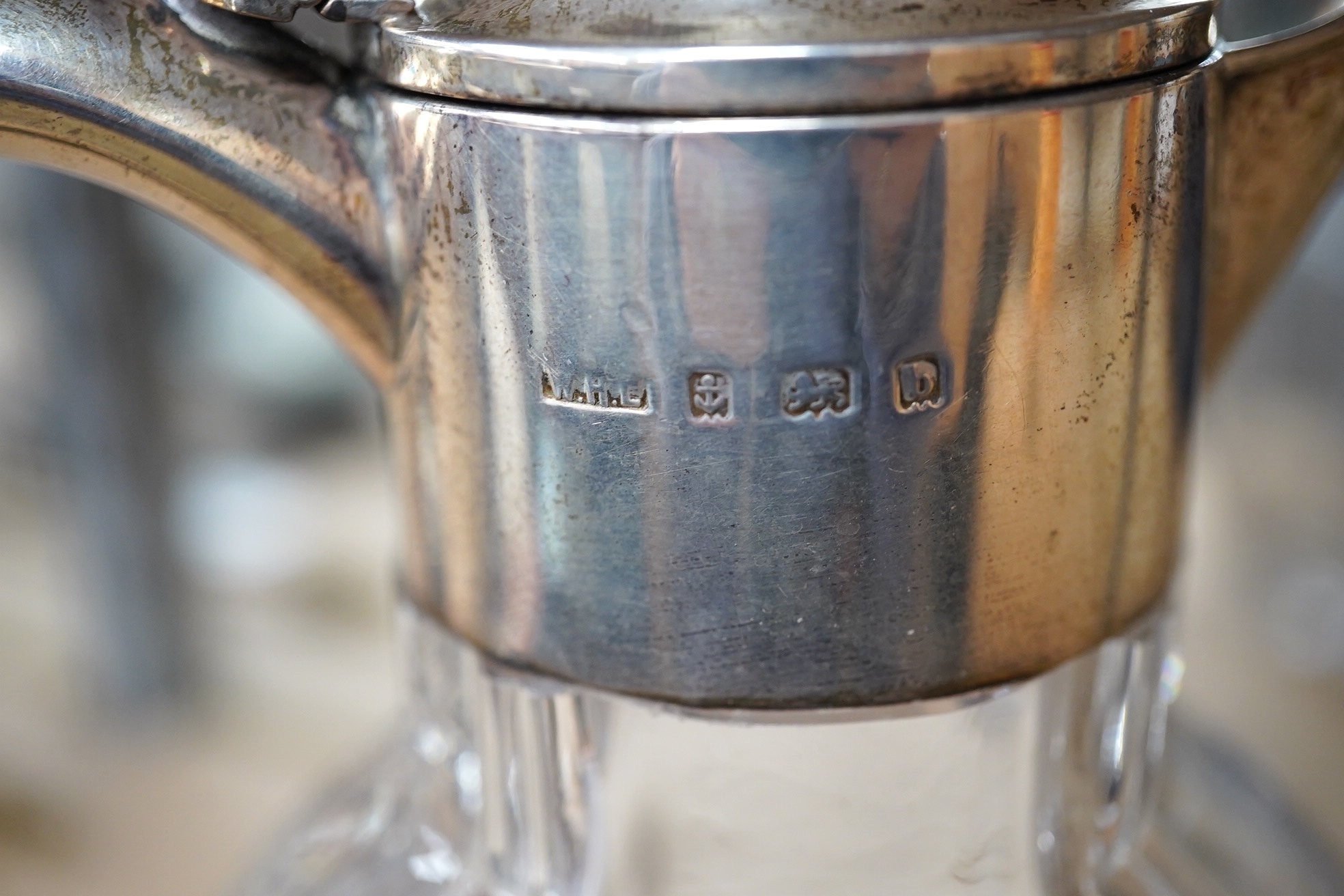 An Edwardian silver mounted glass claret jug, William Henry Leather, Birmingham, 1901, 25.3cm. Condition - poor
